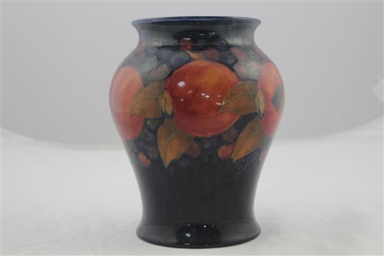 Two William Moorcroft pomegranate pattern vases, c.1916-25, 19cm, latter heavily repaired